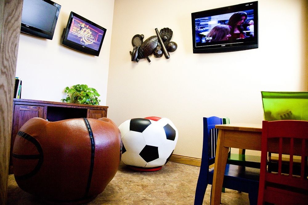 Kids’ play area with TV in the waiting room